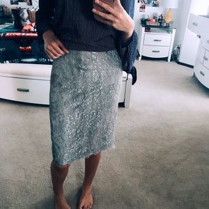 Lace knee length skirt.